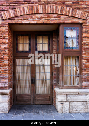 Vintage wooden doors, old house and cobbled narrow street in town ... Vintage wooden doors, old house and cobbled narrow street in town ...