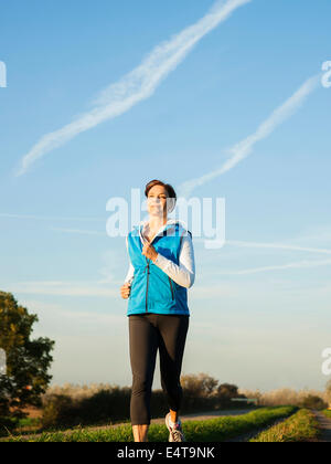 Mature Woman Jogging Outdoors Baden Wurttemberg Germany Stock Photo