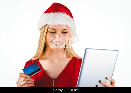 Festive Blonde Shopping Online With Tablet Pc Stock Photo Alamy