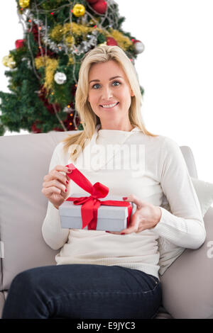 Festive Blonde Opening A Gift Stock Photo Alamy