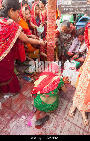 During The Celebration Of Holi A Group Of Women Punch Naked Torsos Of