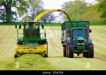 John Deere Self Propelled Forage Harvesters And Bailey Mechanical Silage Trailers Stock