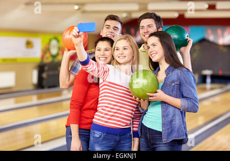 Of Friends At A Bowling Alley Laughing And Of Friends At A Bowling Alley Laughing And