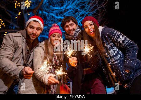 http://l450v.alamy.com/450v/ehy8dw/group-of-friends-with-sparklers-having-fun-ehy8dw.jpg