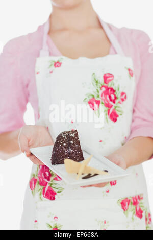 Housewife Eating A Slice Of Chocolate Cake Stock Photo Alamy