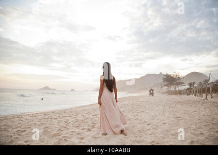 Rear View Of Naked Mid Adult Woman Running Into The Sea On El Matador