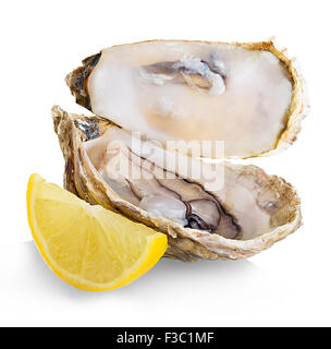 Oysters With Lemon On White Plate Stock Photo Alamy