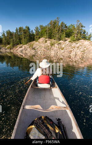 http://l450v.alamy.com/450v/f965wa/woman-paddling-in-the-bow-of-a-canoe-on-george-lake-in-killarney-provincial-f965wa.jpg