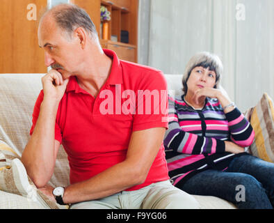 http://l450v.alamy.com/450v/f9yg06/mature-couple-after-quarrel-in-living-room-at-home-f9yg06.jpg