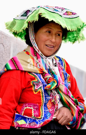 Peruvian Woman In Traditional Costume With Llama At Sacsayhuaman Near