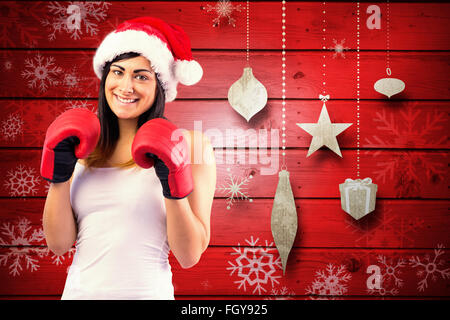 Composite Image Of Festive Brunette With Boxing Gloves Stock Photo Alamy