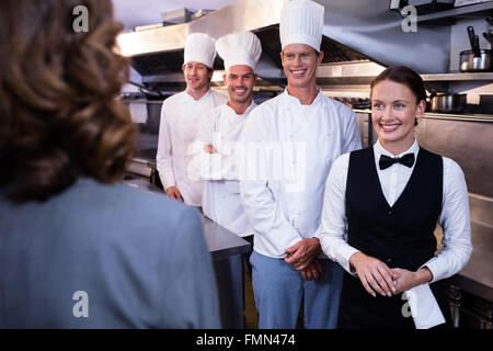 Restaurant Kitchen Staff restaurant manager briefing to his kitchen staff stock photo Restaurant Kitchen Staff restaurant manager briefing to his kitchen staff stock photo
