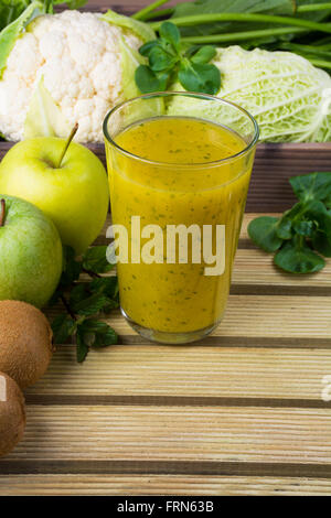 Glass Of Kiwifruit Smoothie And Fruits On Wooden Table Stock Photo Alamy