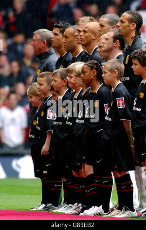 Manchester United Players Line Up Ahead Of Kick Off During The Premier