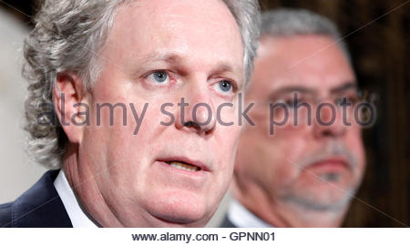 ... during a news conference with Public Security Minister Jacques Dupuis (