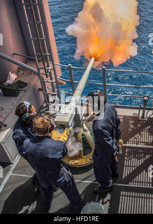 Sailors Fire A 40mm Saluting Battery Aboard The Amphibious Assault Ship