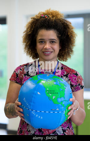 portrait of a mixed race teacher with tattoos in the hall portrait of a mixed race teacher with tattoos in the hall