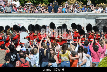 Tourists Watch The Changing Of The Guard At Buckingham Palace London