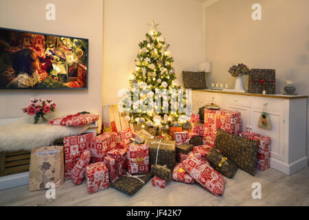 Christmas Tree In Living Room bright christmas tree in living room with burning fireplace and Christmas Tree In Living Room bright christmas tree in living room with burning fireplace and