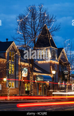 Main street shops decorated with Christmas lights, Estes Park Stock
