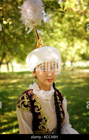 Uzbek Woman In National Costumes Playing Local Musical Instrument Of