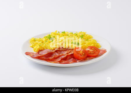 Scrambled Egg With Lean Streaky Bacon Stock Photo Alamy