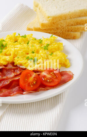 Scrambled Egg With Lean Streaky Bacon Stock Photo Alamy