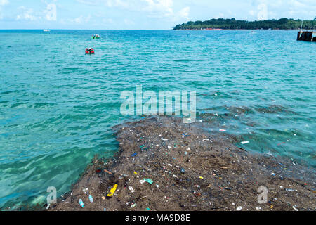 Underwater Photo Of Plastic Trash Pollution On The Seabed On A Coral