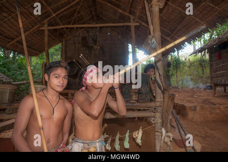 A Palawano Boy Demonstrates The Use Of A Bamboo Blowgun At The Palawan