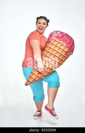 Brunette Chubby Woman Is Holding A Huge Ice Cream Stock Photo Alamy