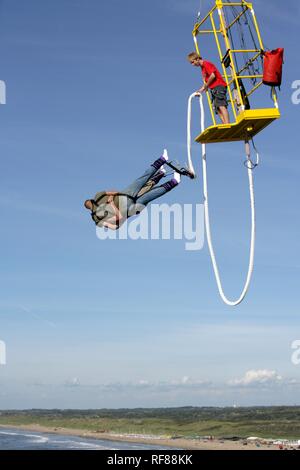 Bungee Jumping From Scheveningen Pier At Sunset Viewed From The Pier