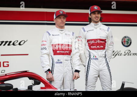 Drivers Kimi Raikkonen Left And Antonio Giovinazzi Unveil The New