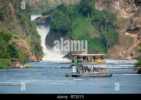 A Tourist Boat At Murchison Falls Waterfall On The Victoria Nile River