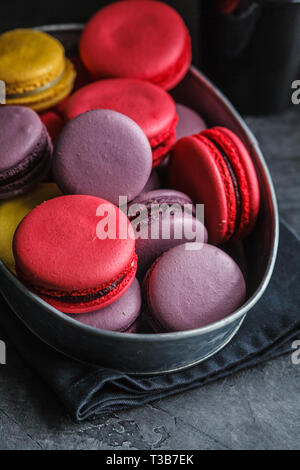 Colorful Macaroon In Black Dish On Wooden Floor Stock Photo Alamy