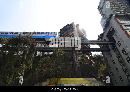 A Monorail Train Of Chongqing Light Rail Runs Through High Rise