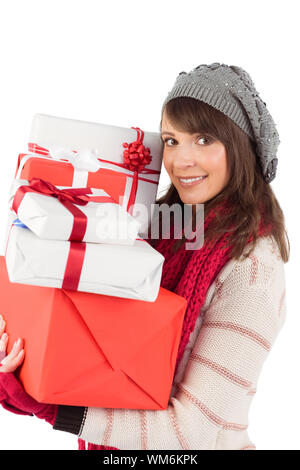 Festive Brunette Holding Pile Of Gifts Stock Photo Alamy