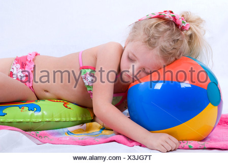 Girl In Bikini Sleeping On Beach Ball Stock Photo 48890519 Alamy