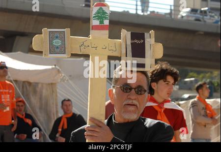 A Lebanese Supporter Of Hezbollah And Its Pro Syrian Allies Hangs A