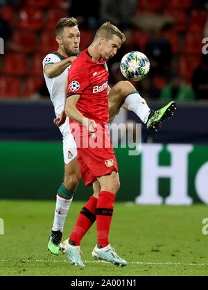 Leverkusen, Germany. 18th Sep, 2019. Lars Bender (R) of Leverkusen vies with Maciej Rybus of Moscow during the UEFA Champions league group D soccer match between Bayer 04 Leverkusen and FC Lokomotiv Moscow in Leverkusen, Germany, Sept. 18, 2019. Credit: Joachim Bywaletz/Xinhua Stock Photo