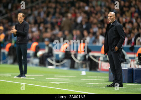 Madrid, Spain. 18th Sep, 2019. Coach of Real Madrid Zinedine Zidane and coach of Paris Saint-Germain Thomas Tuchel look on during their Group A match at 2019-2020 UEFA Champions League in Madrid, Spain, Sept. 18, 2019. Credit: Jack Chan/Xinhua Stock Photo