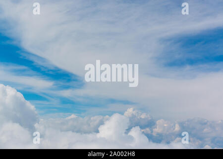 Bright sky blue background. Sky in daylight with beautiful white cloud, can be use for background. Stock Photo
