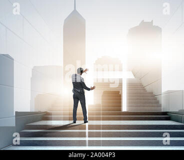 Businessman climbing up challenging career ladder in business concept ...