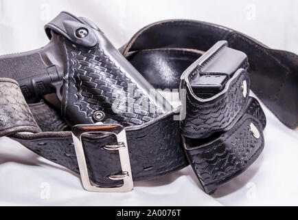 Equipment belt with gun and handcuffs on NYPD police woman Stock Photo ...