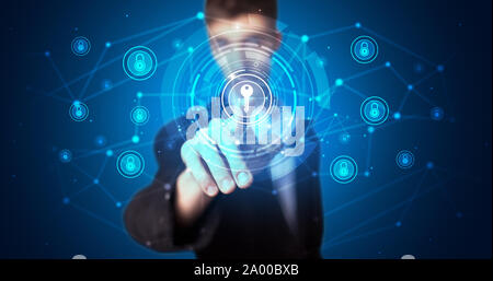 Man touching hologram screen displaying keys and locks Stock Photo
