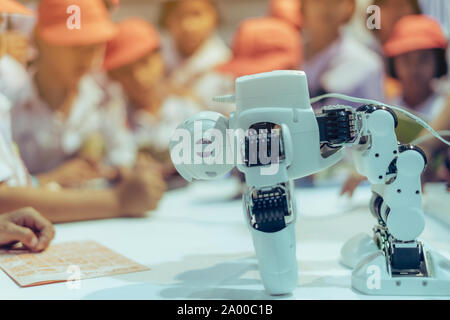Students are testing robot control in an elementary school laboratory. Stock Photo