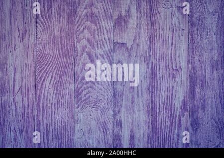 Wooden background texture. Creatively painted intense violet boards. Stock Photo