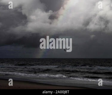 A rainbow forms after an afternoon storm in Ocean City, Maryland Stock ...