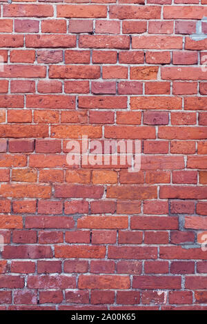 Vertical red bricks background. A part of wall of the building Stock Photo