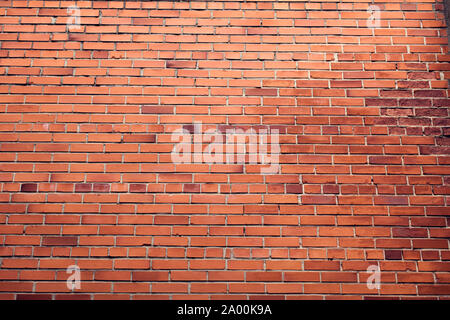 Horizontal red bricks background. A part of wall of the building Stock Photo
