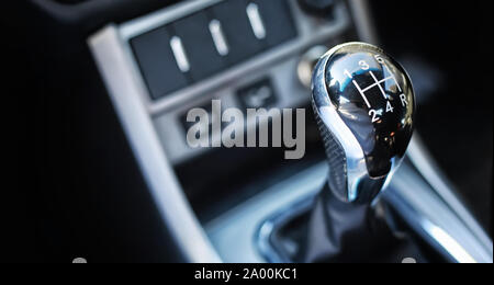 Gear lever. Manual Transmission. Hand on the gear shift in the car. Stock Photo
